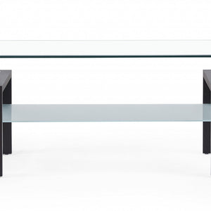 Mesa de centro con patas de nogal oscuro y tapa rectangular de cristal transparente