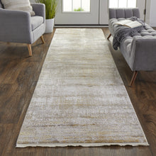 3' X 5' Taupe Ivory And Gold Abstract Power Loom Distressed Area Rug With Fringe