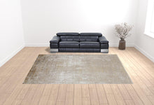 3' X 5' Taupe Ivory And Gold Abstract Power Loom Distressed Area Rug With Fringe