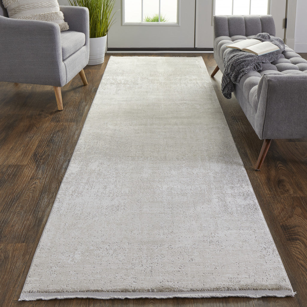 3' X 5' Taupe Ivory And Gold Abstract Power Loom Distressed Area Rug With Fringe