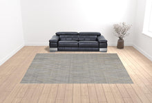 5' X 8' Gray And Ivory Abstract Hand Woven Area Rug