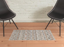4' X 6' Tan Taupe And Ivory Geometric Power Loom Stain Resistant Area Rug