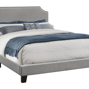 Gray Standard Bed Upholstered With Nailhead Trim And With Headboard