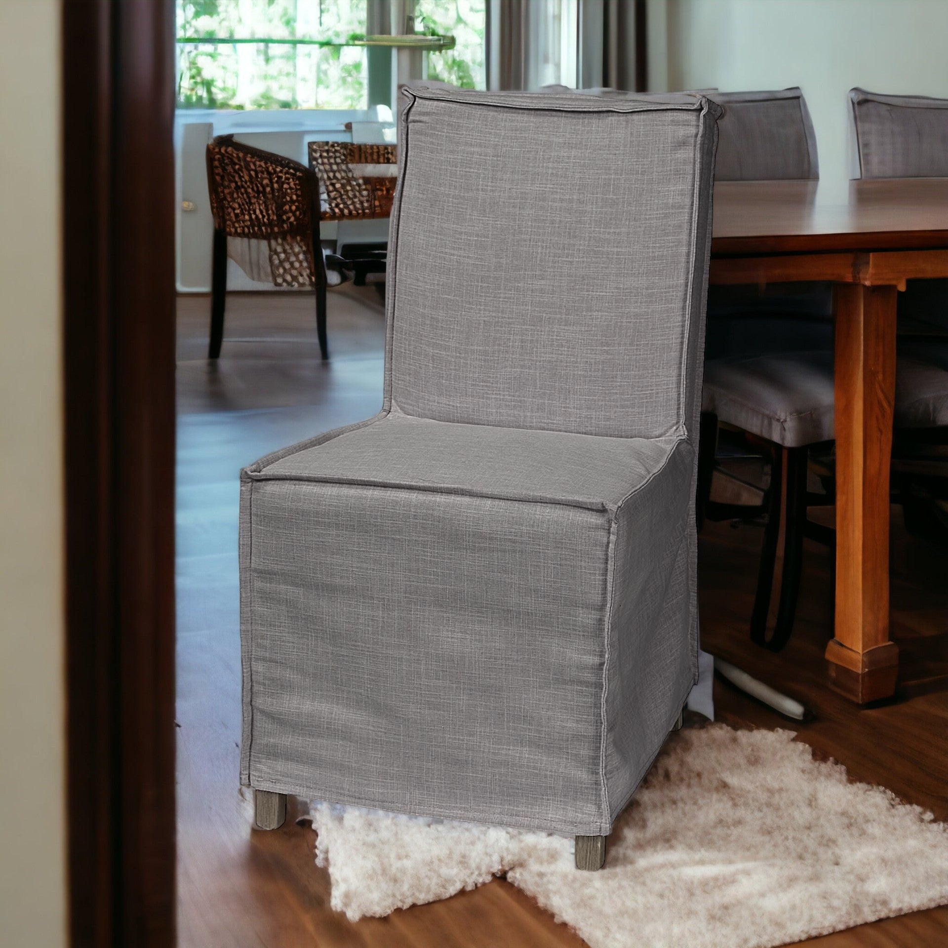 Grey Fabric Slip Cover With Brown Wooden Base Dining Chair