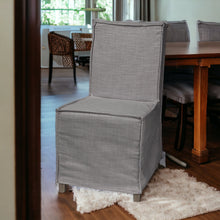 Grey Fabric Slip Cover With Brown Wooden Base Dining Chair