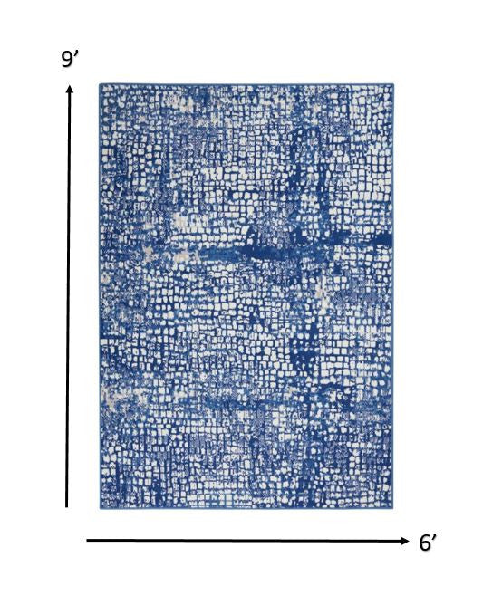 4’ X 6’ Ivory And Navy Abstract Grids Area Rug