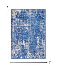 4’ X 6’ Blue And Ivory Abstract Splash Area Rug