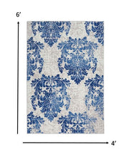 4’ X 6’ Ivory And Navy Damask Area Rug