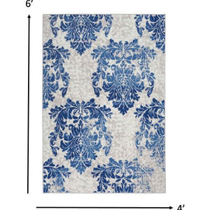 4’ X 6’ Ivory And Navy Damask Area Rug