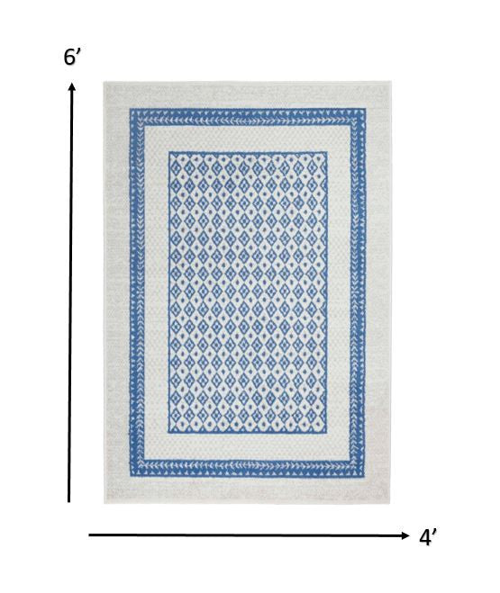 4’ X 6’ Ivory And Blue Geometric Area Rug