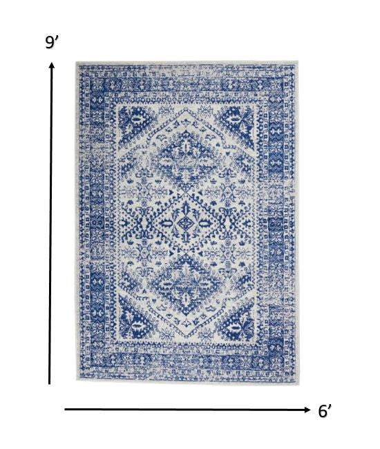 4’ X 6’ Ivory And Navy Geometric Area Rug