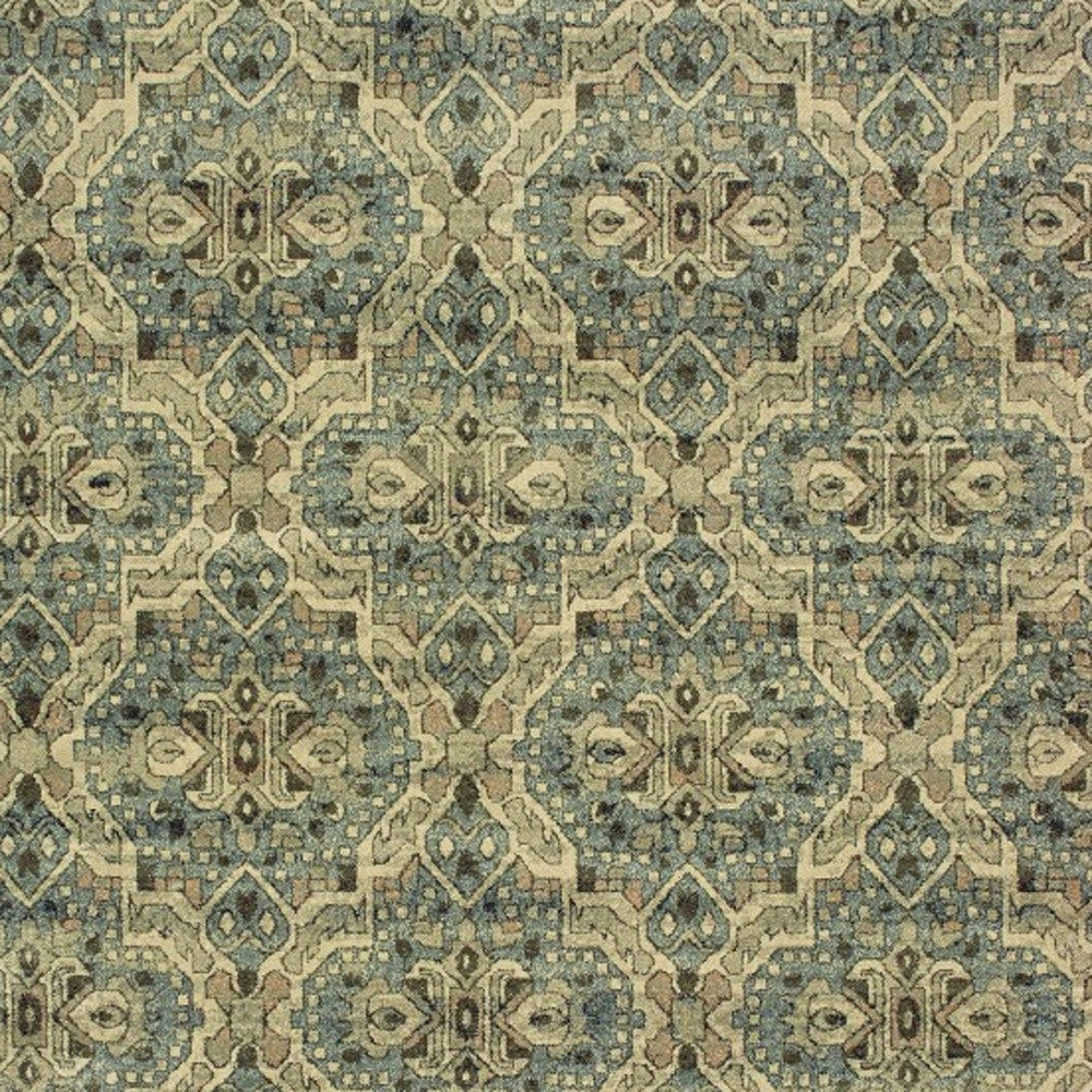 5’X8’ Ivory And Blue Geometric Area Rug