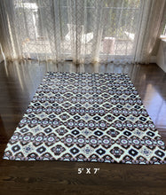 5' X 7' Light And Blue Oriental Area Rug