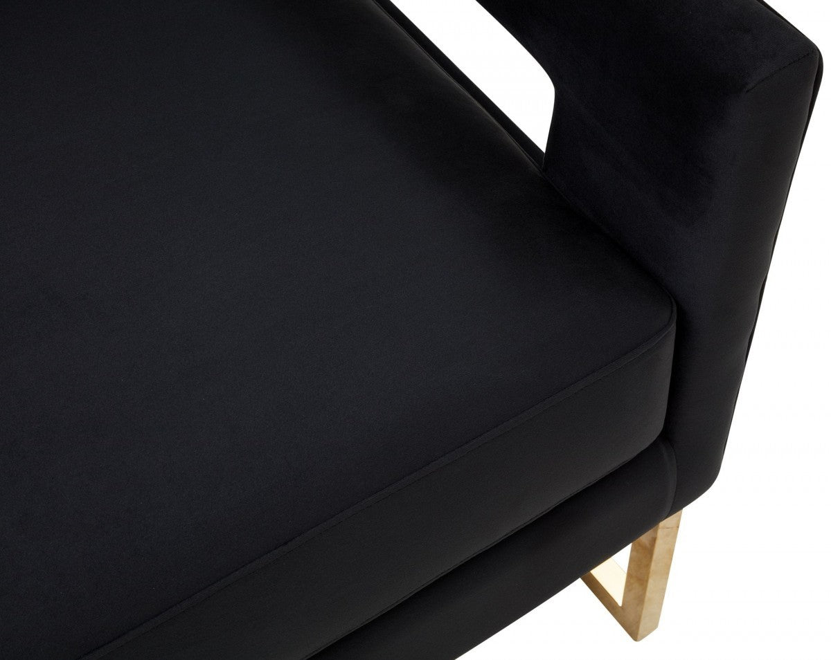 Elegante silla de terciopelo negro y acero dorado