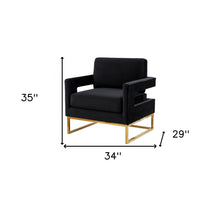 Elegante silla de terciopelo negro y acero dorado