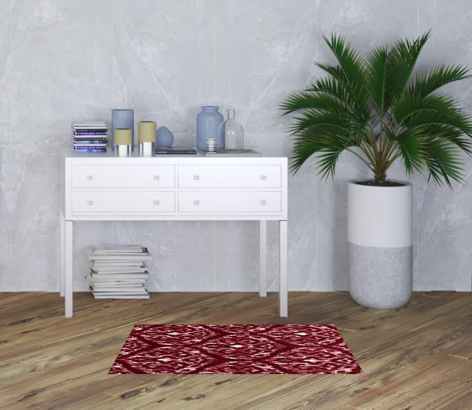 2' X 4' Red And White Ikat Tufted Washable Non Skid Area Rug