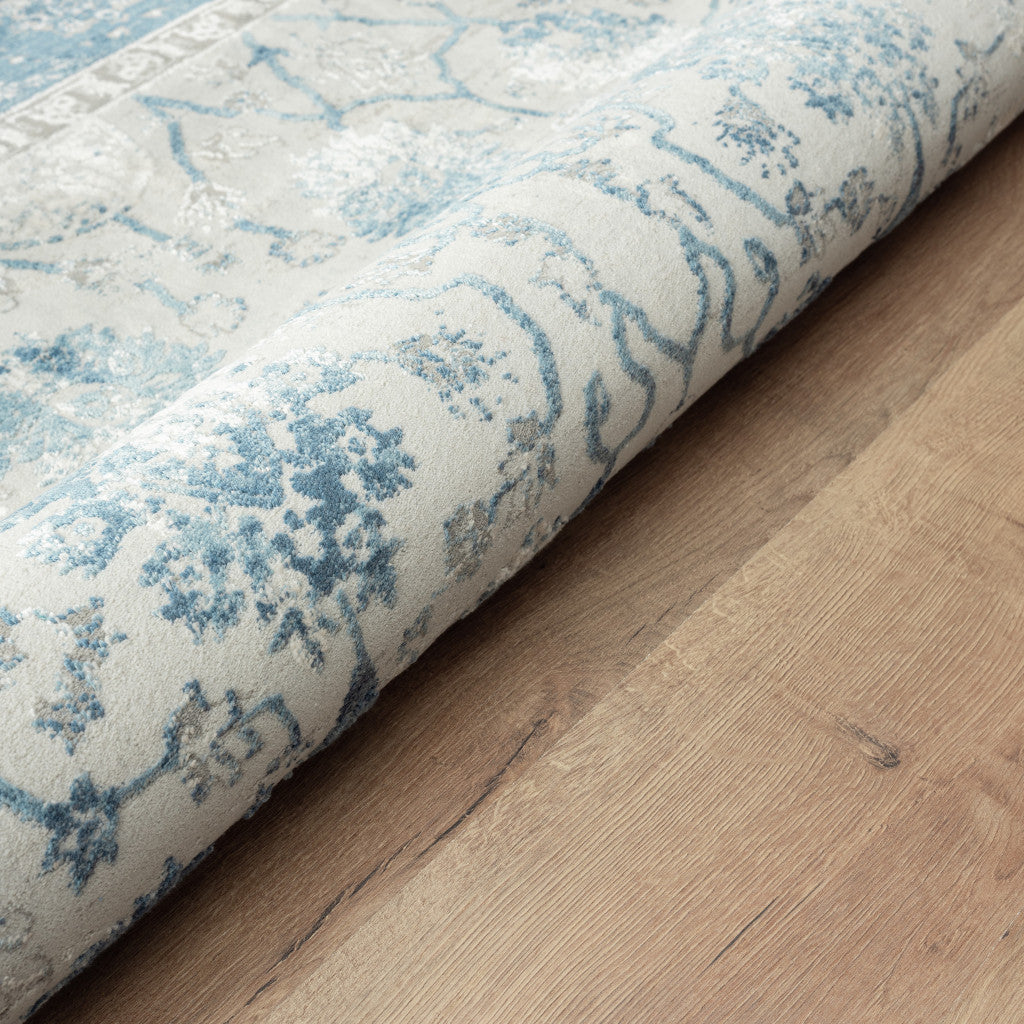 5' X 8' Blue Gray And Ivory Floral Power Loom Stain Resistant Area Rug