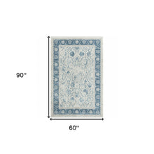 5' X 8' Blue Gray And Ivory Floral Power Loom Stain Resistant Area Rug