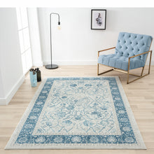 8' X 10' Blue Gray And Ivory Floral Power Loom Stain Resistant Area Rug