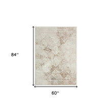 5' X 7' Beige Cream And Brown Damask Stain Resistant Area Rug