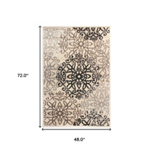 4' X 6' Tan Gray And Black Floral Medallion Stain Resistant Area Rug
