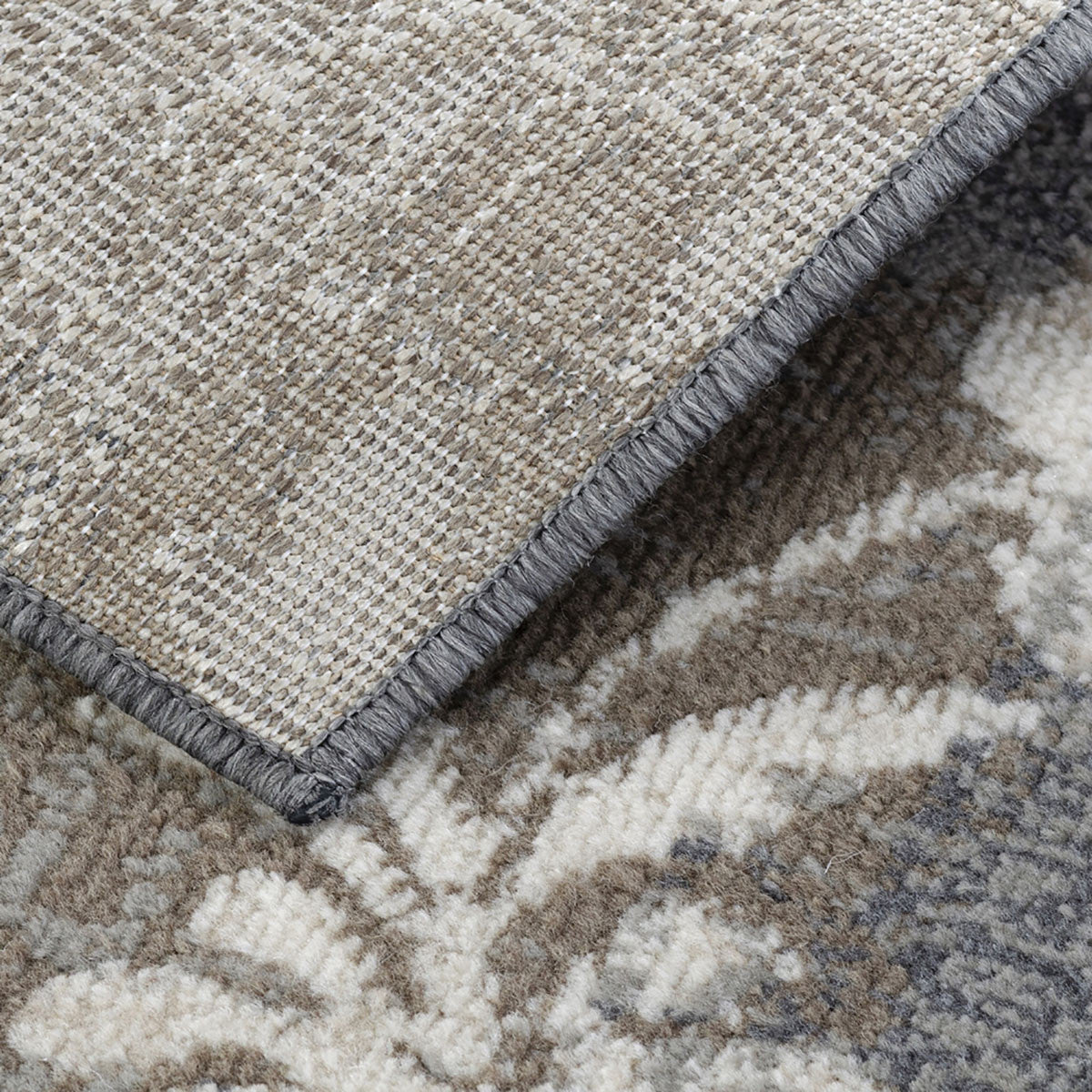 5' X 8' Brown And Ivory Floral Power Loom Distressed Stain Resistant Area Rug