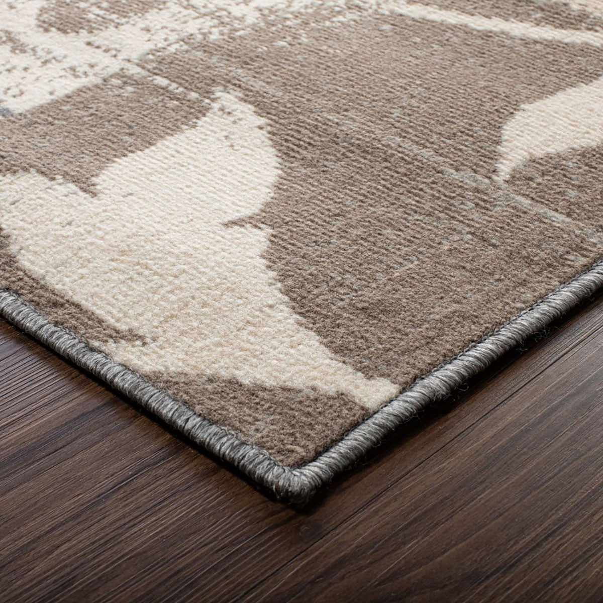 5' X 8' Brown And Ivory Floral Power Loom Distressed Stain Resistant Area Rug