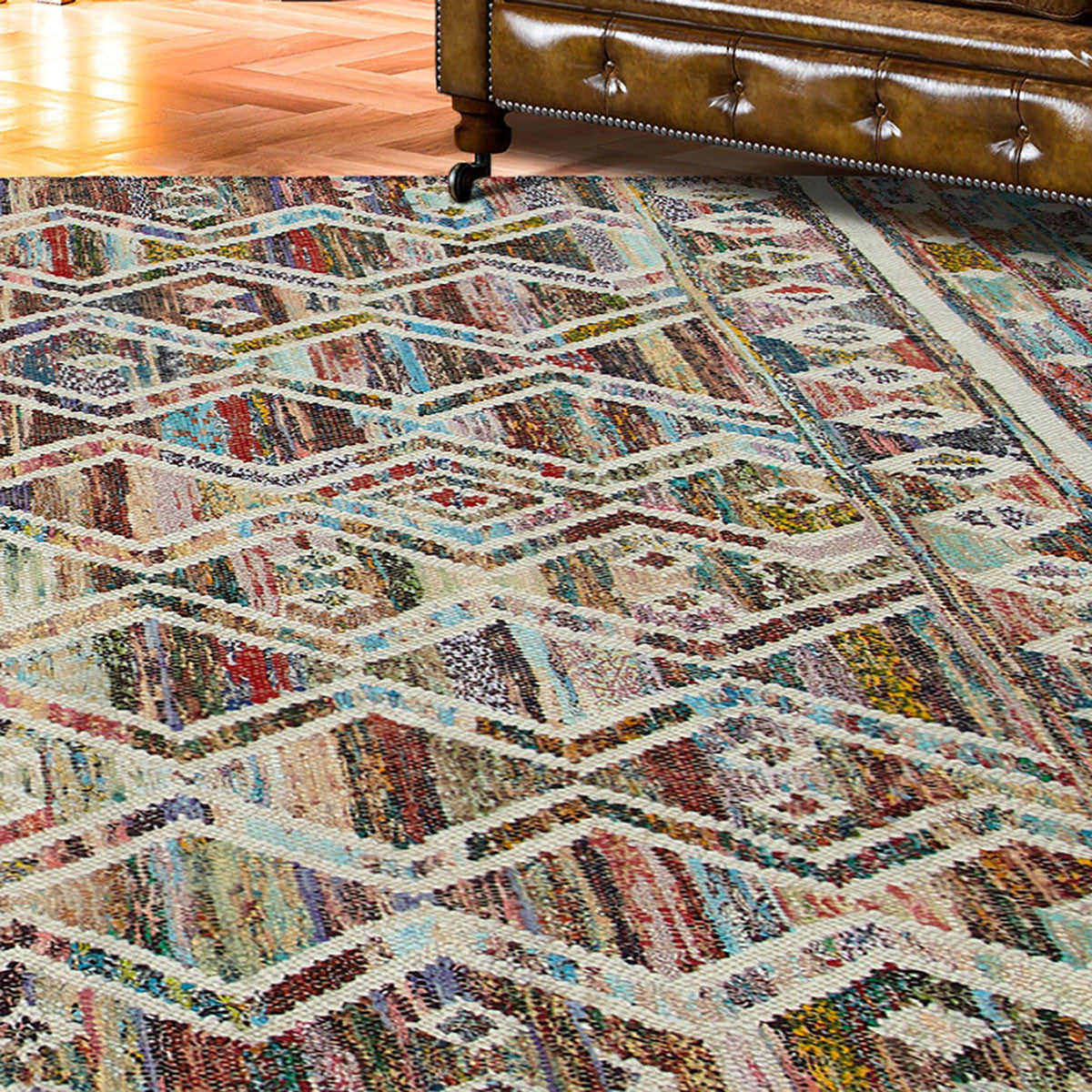 5' X 8' Ivory Blue Pink Gold And Green Geometric Hand Woven Area Rug With Fringe