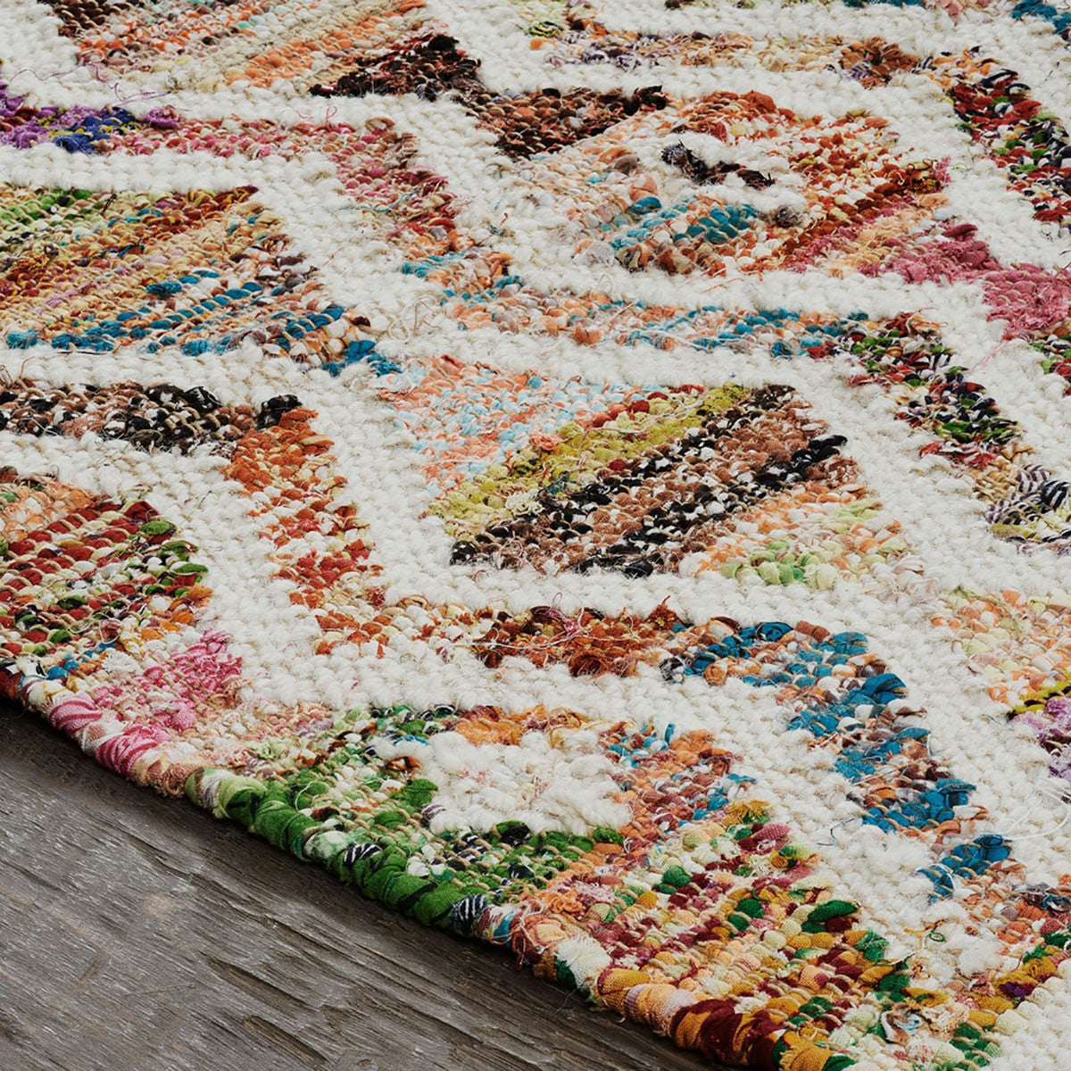 8' X 10' Ivory Blue Pink Gold And Green Geometric Hand Woven Area Rug With Fringe