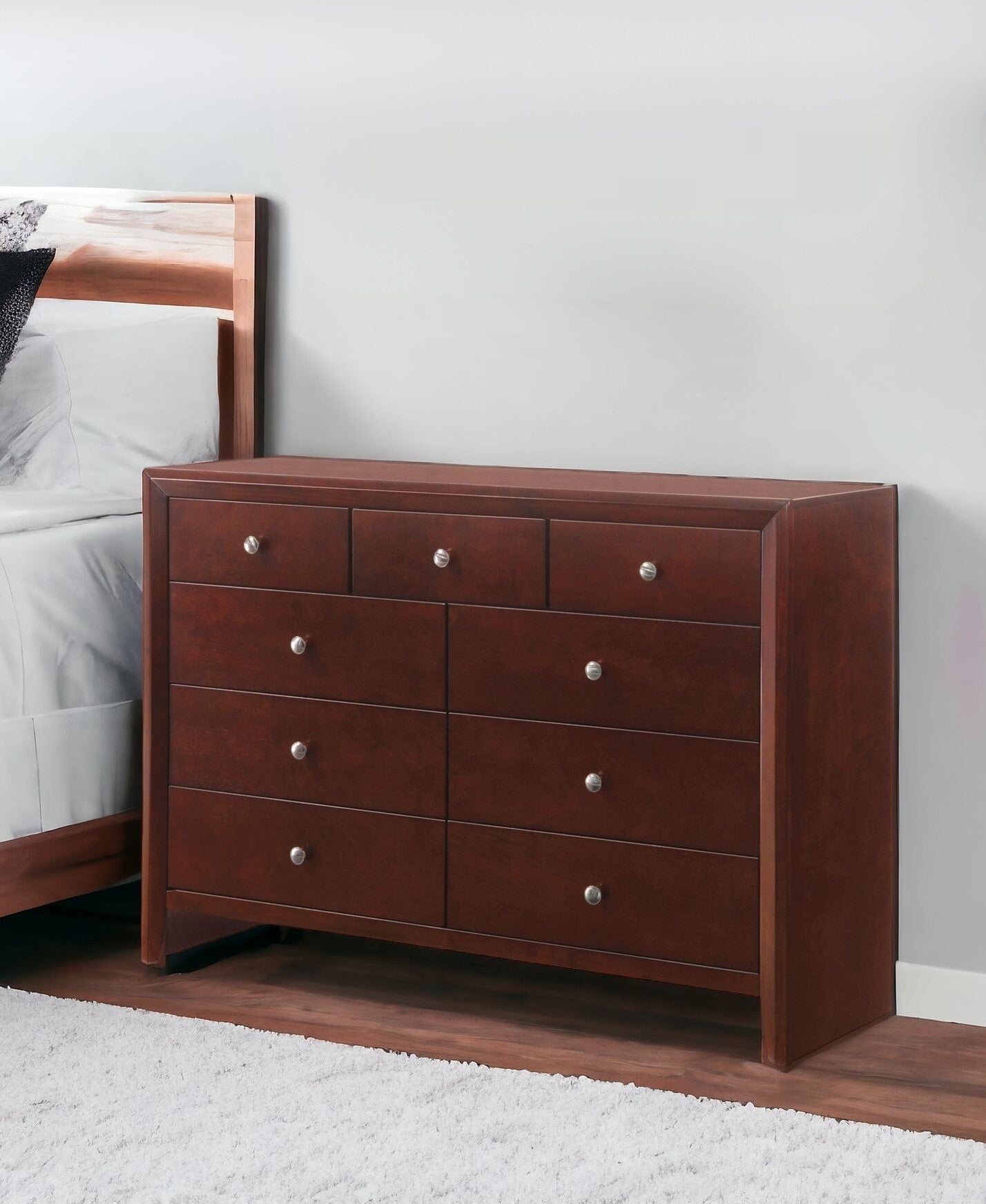 55" Brown Cherry Manufactured Wood Nine Drawer Triple Dresser