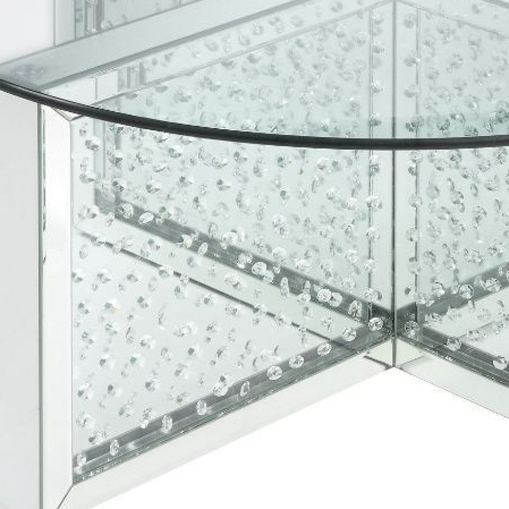 Mesa de centro con base brillante y parte superior redonda plateada y de vidrio transparente de 40"