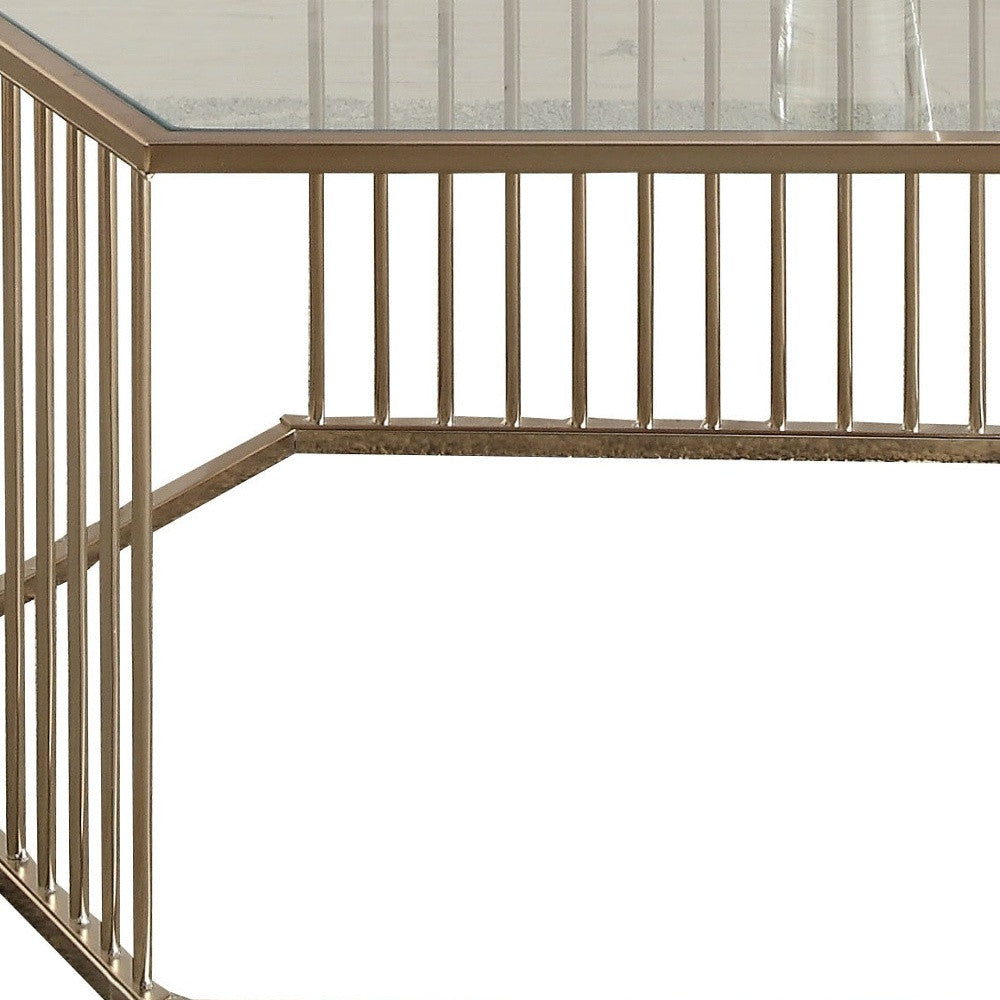 Mesa de centro hexagonal de metal y champán y vidrio transparente de 34"