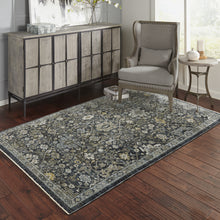 6' X 9' Blue Ivory Grey Gold Green And Brown Oriental Power Loom Stain Resistant Area Rug With Fringe