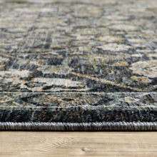 6' X 9' Blue Ivory Grey Gold Green And Brown Oriental Power Loom Stain Resistant Area Rug With Fringe