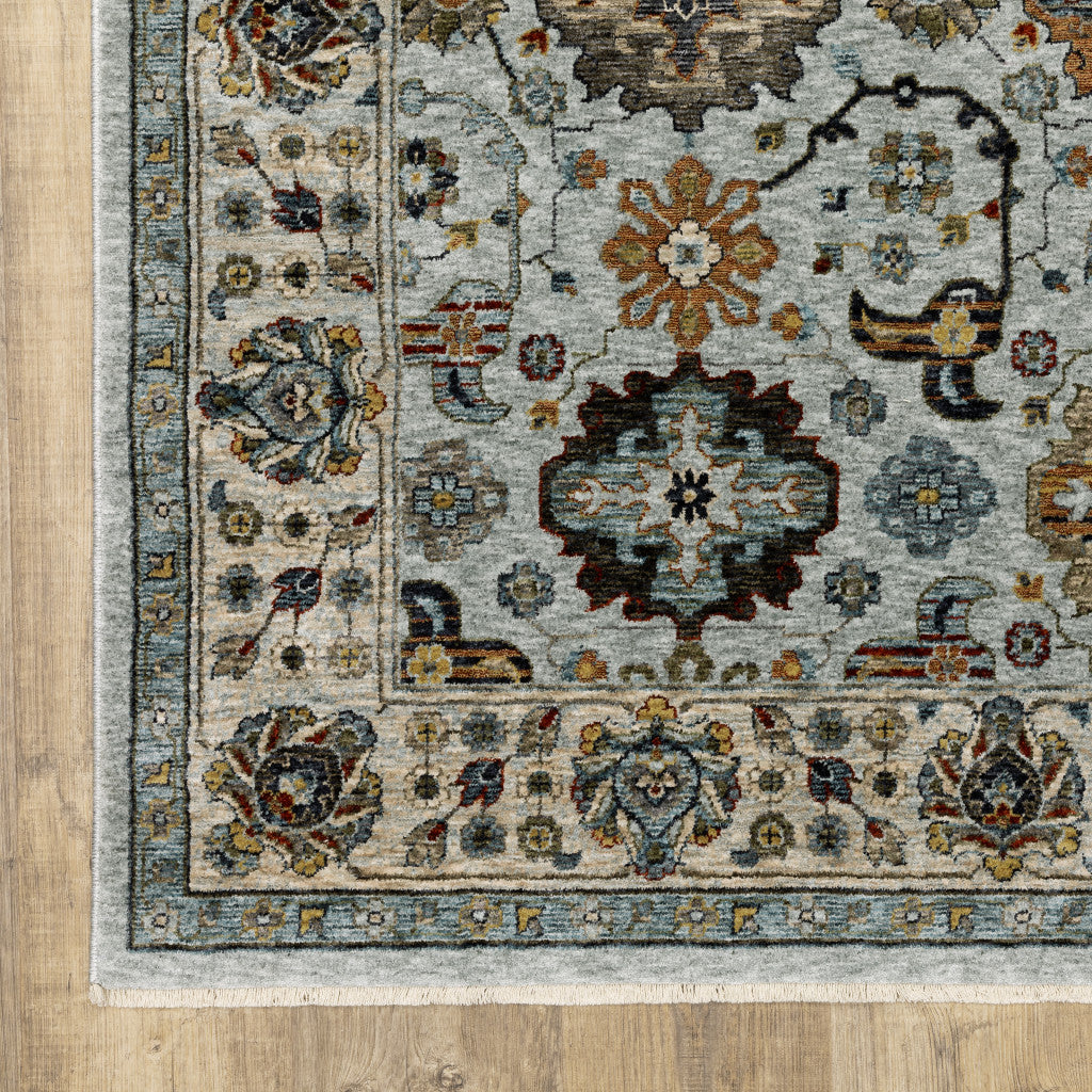 8' X 11' Blue Beige Grey Green Yellow And Rust Oriental Power Loom Stain Resistant Area Rug With Fringe