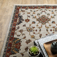 5' X 8' Beige Rust Red Blue Gold And Grey Oriental Power Loom Stain Resistant Area Rug With Fringe