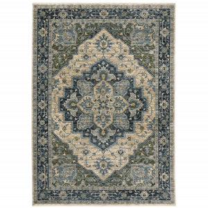 6' X 9' Blue Grey Beige Tan Green And Gold Oriental Power Loom Stain Resistant Area Rug With Fringe