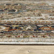 5' X 8' Ivory Beige Blue Orange Gold Green Grey And Rust Oriental Power Loom Stain Resistant Area Rug With Fringe