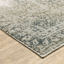 5' X 8' Grey Beige And Teal Oriental Power Loom Stain Resistant Area Rug