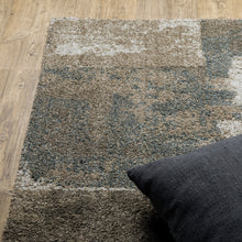 3' X 5' Teal Blue Grey Tan And Beige Geometric Power Loom Stain Resistant Area Rug