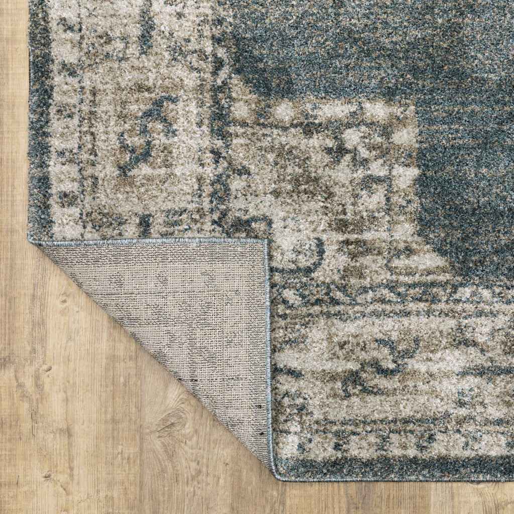 6' X 9' Blue And Beige Oriental Power Loom Stain Resistant Area Rug