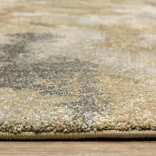 5' X 8' Beige Grey And Gold Abstract Power Loom Stain Resistant Area Rug