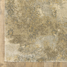 8' X 11' Beige Grey Tan And Gold Abstract Power Loom Stain Resistant Area Rug