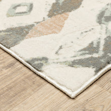 5' X 8' Ivory Pink And Sage Geometric Power Loom Stain Resistant Area Rug