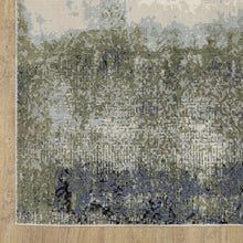 8' X 11' Blue Green Grey And Beige Abstract Power Loom Stain Resistant Area Rug