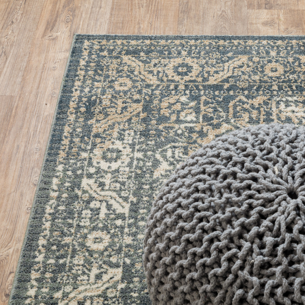 5' X 7' Beige Grey And Blue Oriental Power Loom Stain Resistant Area Rug