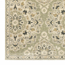 5' X 8' Green Ivory Grey And Tan Floral Power Loom Stain Resistant Area Rug