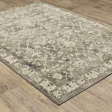 6' X 9' Grey Beige Tan And Brown Oriental Power Loom Stain Resistant Area Rug
