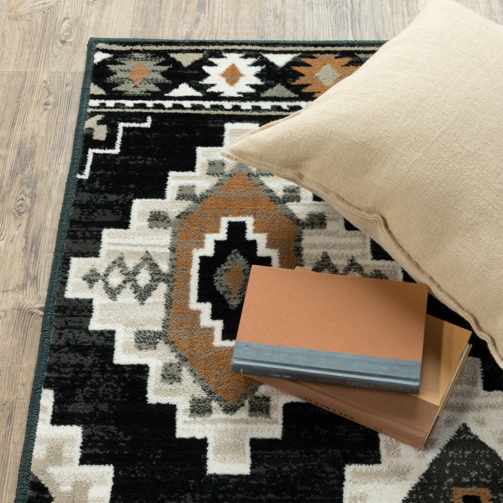 8' X 10' Black Grey Tan Orange And Ivory Southwestern Power Loom Stain Resistant Area Rug