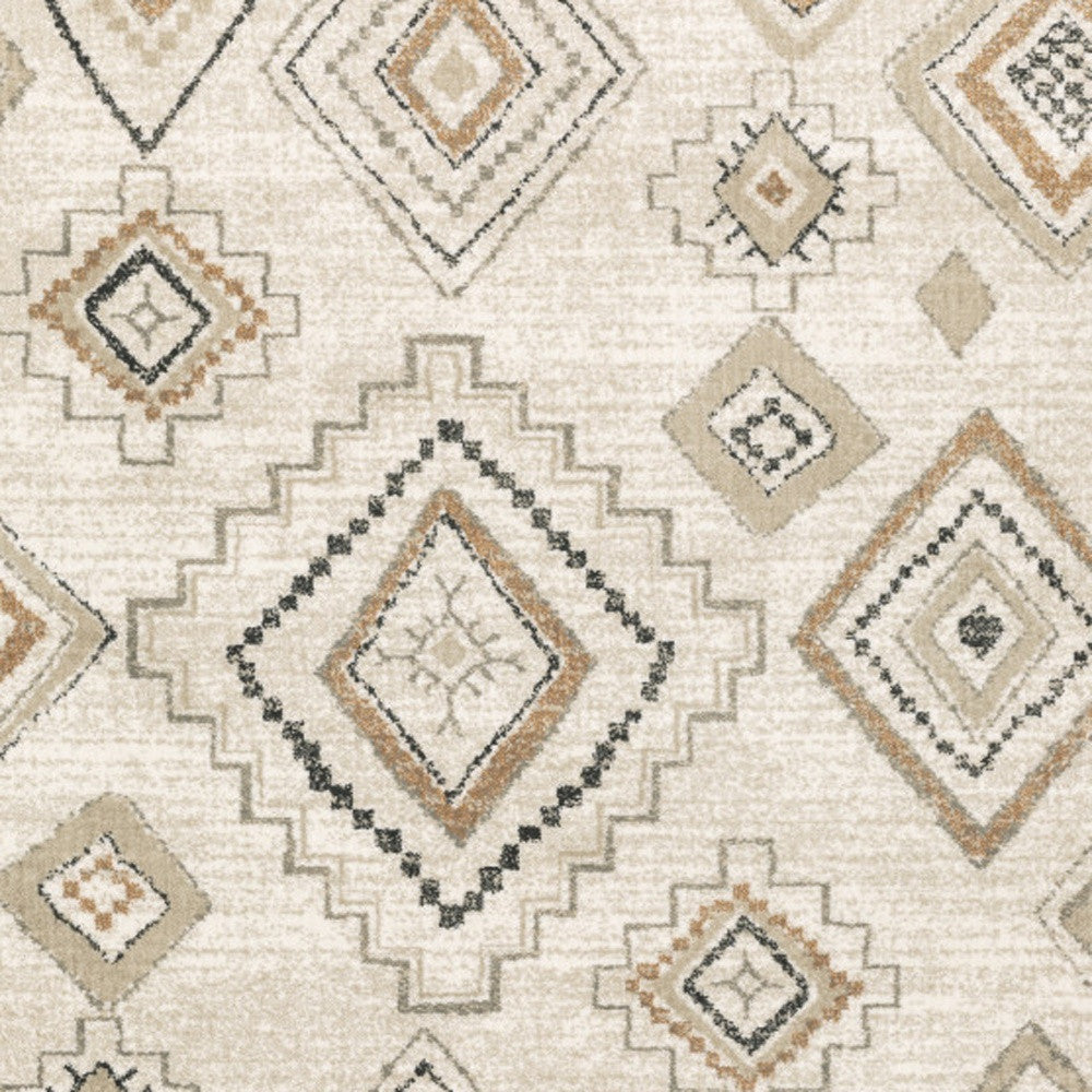 6' X 9' Ivory Orange Tan Black And Grey Southwestern Power Loom Stain Resistant Area Rug